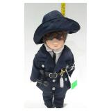 10" porcelain doll in blue uniform with doll stand