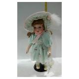 14" porcelain doll in light green dress with