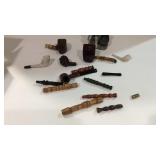 Box with tobacco pipe heads some may have damage