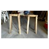 Two wooden saw horses, measures 33 inches tall