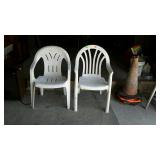 Two plastic lawn chairs