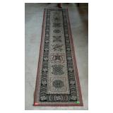 Runner rug by Suprema - rust, black, and beige,