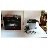 Nespresso machine with instruction manual, coffee