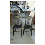 Two black leaf pattern side chairs needs a touch