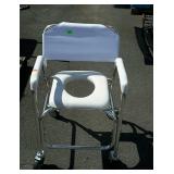 Handicapped potty chair on wheels