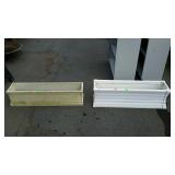 Two plastic window planters both measure 36