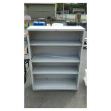 Metal book case, measures 35 inches tall, by 17