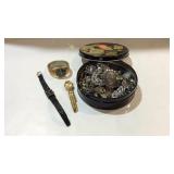 Tin with jewelry and wrist watches