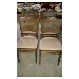 Set of four folding chairs with padded beige