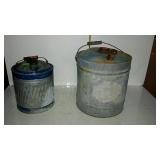 Two metal fuel cans - larger can has dents, rust,