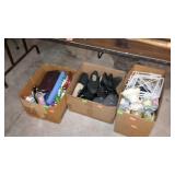 Three boxes with glassware, shoes, soap dispenser