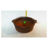 Cast iron Dutch oven pot with wire bail handle,