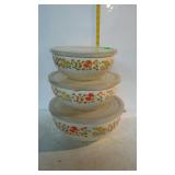 Nest of three floral pattern enamel mixing bowls