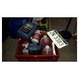 Crate with liquids and a license plate -