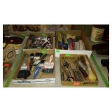 Four flats with paint brushes, utility knife,