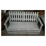 Wooden porch swing, measures 47 inches long,