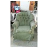 Green swivel arm chair some wear
