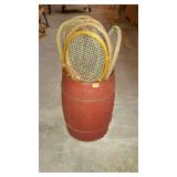 Red painted nail keg, and nine tennis rackets,