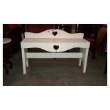 Bench with heart shaped cut-outs, painted white -