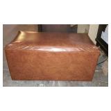 Leather storage ottoman, measures 29 inches long,