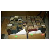 Two boxes of piano rolls