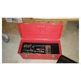 Red toolbox with some tools