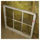 Wooden six pane window missing one glass pane