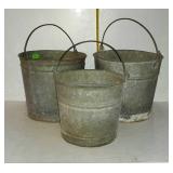 Three galvanized buckets - one good, one has bad