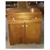 Sewing machine cabinet with hinged top lid and