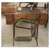 Singer treadle base sewing machine with hinged