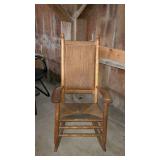 Rush bottom porch rocker with acorn finials and