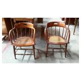 Two oak firehouse style cane bottom chairs