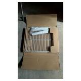 Small metal shelving unit in box