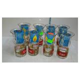 Eight Coke candle holders with candles