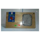 Over the sink  cutting board and strainer