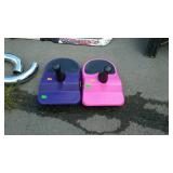 Two little kids snow sleds
