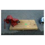 Bench vice attached to board