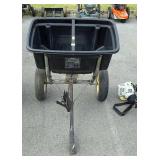 Pull behind behind spreader with owners Manuel,