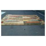 Area rug. Geometric patterns in neutral and rust