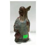 Carved wooden Asian figure. 8" high.