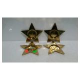 Four brass pillar candle holders
