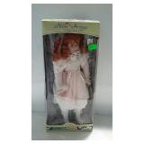 17" porcelain doll - in pink dress with stand and