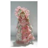 15" porcelain doll in pink floral dress with stand
