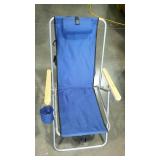 Folding beach chair with head rest and cup holder