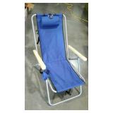 Folding beach chair with head rest and cup holder