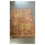 Small tapestry style area rug. Neutral tones in