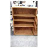 Four shelf book case, it is wooden, measures 36