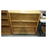 Three shelf wooden book case, measures 36 inches
