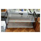 Shoe rack. Metal frame and mesh shelving.