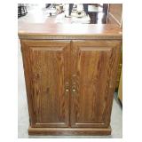 Wooden storage cabinet, measures 31 inches long,